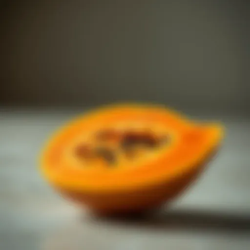 Vibrant Papaya Halved with Orange Flesh Vibrant papaya cut in half showcasing its bright orange flesh
