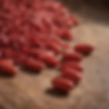 Red Sage Supplement Capsules A close-up of red sage supplement capsules arranged neatly on a wooden surface